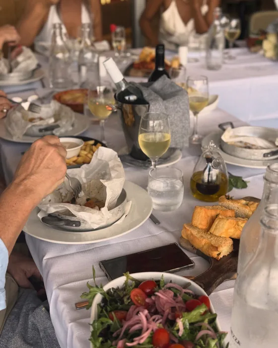 Guests sharing plates down one long table