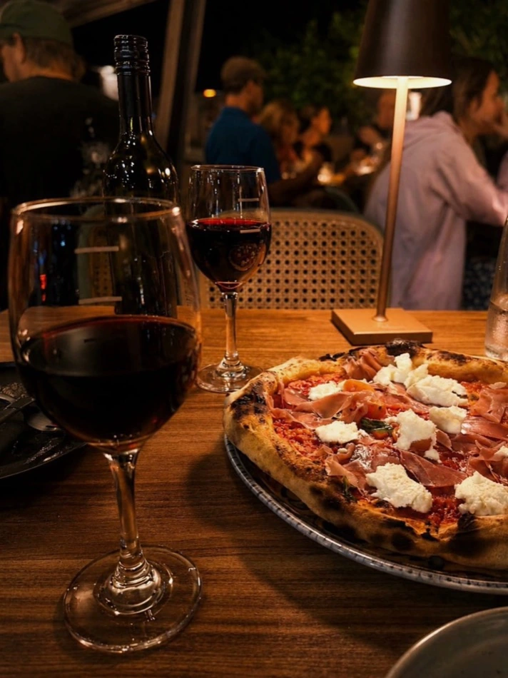 Pizza and red wine on the waterfront at Vitalia's